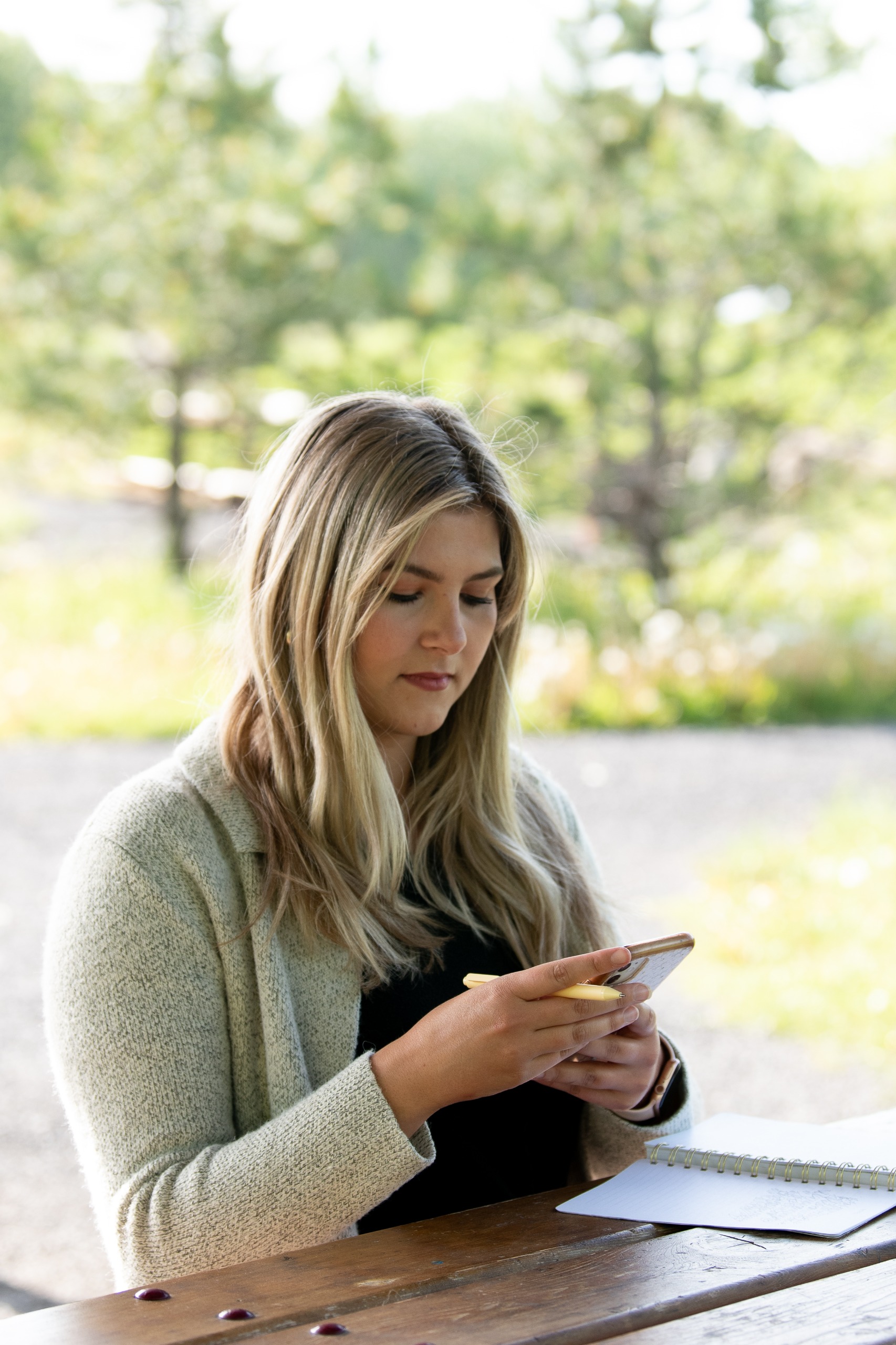 Cochrane app user sitting in a green space